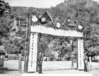 RABAUL, NEW BRITAIN. 1945-10-10. A SPECIAL PARADE AND CONCERT WAS HELD AT THE CHINESE ARMY CAMP TO CELEBRATE THE 34TH ANNIVERSARY OF THE FOUNDING OF THE CHINESE REPUBLIC. SHOWN, VICTORY ARCHWAY AT ..