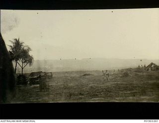 Kelanoa Harbour (near Sio), New Guinea. c. 1944-01. Supply base for the 9th Division advance on Sio. Looking towards mountains, Beach Control tents on left