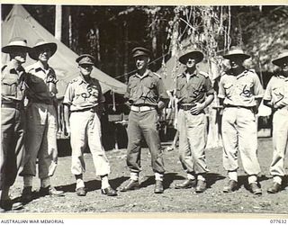 KAMALGAMAN ANCHORAGE, JACQUINOT BAY, NEW BRITAIN. 1944-12-23. THE GENERAL OFFICER COMMANDING, 5TH DIVISION AND THE OFFICIAL PARTY OUTSIDE THE MESS AT HEADQUARTERS, AUSTRALIAN NEW GUINEA ..