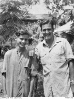 INLAND FROM PORT MORESBY, NEW GUINEA. 1943-11. CAMP SITE AND OPERATIONS ROOM OF UNIT NO 1 WIRELESS UNIT RAAF. IN THE FOREGROUND ARE JAPANESE KANA WIRELESS INTERCEPT OPERATORS:- LEFT TO RIGHT:- ..