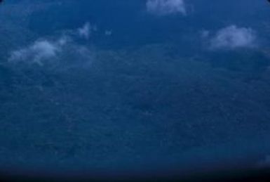 [Aerial view of forested hills on Espiritu Santo, Vanuatu]