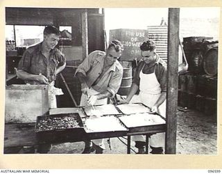 CAPE WOM, WEWAK AREA, NEW GUINEA. 1945-09-15. COOKS OF HEADQUARTERS 6 DIVISION, PREPARING THE MIDDAY MEAL OF SPINACH AND MEAT AND VEGETABLE PIE. IDENTIFIED PERSONNEL ARE:- PRIVATE A. PIPER (1); ..