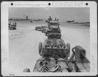 500 Pound Bombs Which Will Be Dropped On Enemy Installations Are Hauled From The Bomb Dump To The Planes Of The 27Th Bomb Squadron, 30Th Bomb Group, 7Th Air Force. Kwajalein, Marshall Islands, 7 April 1944. (U.S. Air Force Number 63424AC)