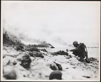 Marines of the First Division burrow deep in the sandy beach of Peleliu as they invaded the Palau Islands group