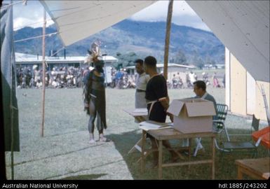 Man collecting ballot paper