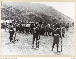 RABAUL, NEW BRITAIN, 1945-12-04. SUSPECTED JAPANESE WAR CRIMINALS WERE ROUNDED UP AND DETAINED IN A COMPOUND IN HQ 11 DIVISION AREA AND GUARDED BY TROOPS OF NEW GUINEA INFANTRY BATTALION. SHOWN, ..