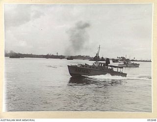 PURUATA ISLAND, SOUTH BOUGAINVILLE. 1945-05-29. A FAST SUPPLY BOAT (CONTROL LAUNCH), MEASURING 38 FEET, MOVES THROUGH THE 42 LANDING CRAFT COMPANY AREA. IT IS POWERED BY 2 CHRYSLER 6 MARINE ..
