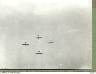 NADZAB, NEW GUINEA. C. 1944-02. B-24 LIBERATOR BOMBER AIRCRAFT OF THE 5TH AIR FORCE, US ARMY AIR FORCE, FLYING OVER NADZAB ON THE WAY TO BOMB JAPANESE POSITIONS IN NEW GUINEA