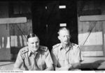 N85071 Lieutenant (Lt) P W Fisher (left), Second in Command of the Anti Aircraft Battery Rabaul, and N85247 Lt D M Selby (right), Officer Commanding, outside their hut at Malaguna Camp. The ..