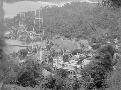 [Elevated view of Pacific Island coastal settlement]