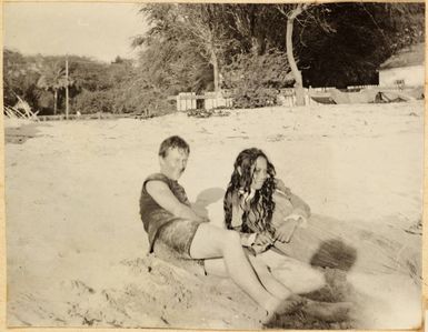 Man and woman on Waikiki beach, Honolulu, 1900