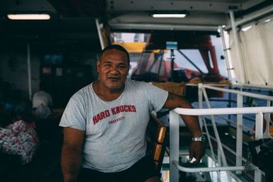 Man on the deck of the ferry Mataliki, Fakaofo, Tokelau