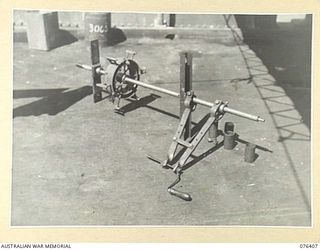 LABU, NEW GUINEA. 1944-10-03. AN IMPROVISED CYLINDER GRINDING APPLIANCE WHICH MEMBERS OF THE 1ST WATERCRAFT WORKSHOPS MADE UP TO GRIND THE CYLINDERS OF THE "FRANCES PEAT". THE "FRANCES PEAT" WAS A ..