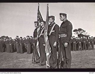 MOUNT MARTHA, VIC. 1943-05-18. THE COLOUR GUARD OF THE 7TH UNITED STATES MARINE REGIMENT AT A CEREMONIAL PARADE WHEN MEMBERS OF THE REGIMENT WERE DECORATED FOR GALLANTRY ON GUADALCANAL. LEFT TO ..