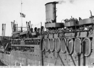 SYDNEY, NSW. 1942-08-28. DETAIL VIEW, STARBOARD SIDE AMIDSHIPS, OF THE AMERICAN TRANSPORT PRESIDENT GRANT COMING ALONGSIDE WITH SURVIVORS OF THE CRUISER HMAS CANBERRA, SUNK ON 1942-08-09 AFTER ..