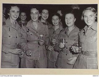 LAE, NEW GUINEA. 1945-03-26. AUSTRALIAN ARMY NURSING SERVICE PERSONNEL AT THE SISTERS MESS, 2/7 GENERAL HOSPITAL, DURING THE VISIT OF LADY WAKEHURST AND LADY BLAMEY. IDENTIFIED PERSONNEL ARE:- ..