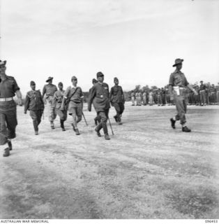 CAPE WOM, NEW GUINEA, 1945-09-13. LIEUTENANT-GENERAL H. ADACHI, COMMANDER 18 JAPANESE ARMY IN NEW GUINEA FORMALLY SURRENDERED TO MAJOR-GENERAL H.C.H. ROBERTSON, GENERAL OFFICER COMMANDING 6 ..