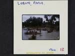 [People in canoes by seashore], Losiua [Losuia], Papua, [Papua New Guinea, 29 May] 1964