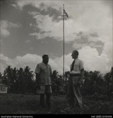 Field Officer speaking with Fijian farmer