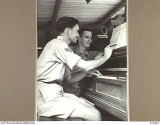 1943-04-05. NEW GUINEA. WITH THE AID OF AN OLD HAND PUMPED ORGAN CPL. CLIFTON JOHNS OF ALBERTON, S.A., HAS COMPOSED A NUMBER OF SONGS IN HIS SPARE TIME IN NEW GUINEA. HIS LATEST COMPOSITION ..