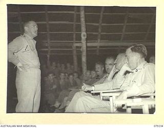 KALUMALAGI RIVER, NEW BRITAIN. 1945-02-24. VX27 MAJOR- GENERAL A.H. RAMSAY, CBE, DSO, ED, GENERAL OFFICER COMMANDING 5TH DIVISION (1) SPEAKING DURING THE OFFICIAL OPENING CEREMONY OF THE NEW ..