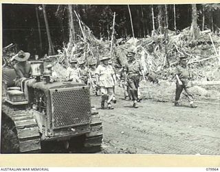 TOKO, SOUTH BOUGAINVILLE. 1945-03-26. VX1 GENERAL SIR THOMAS BLAMEY, GBE, KCB, CMG, DSO, ED, COMMANDER- IN- CHIEF, ALLIED LAND FORCES, SOUTH WEST PACIFIC AREA (2), ACCOMPANIED BY SENIOR OFFICERS, ..