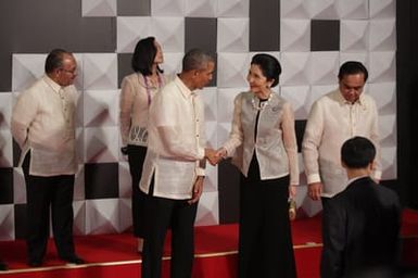 Barack Obama joins Asia Pacific Economic Cooperation Summit leaders and spouses for a group photo in Pasay, Metro Manila, Philippines, November 18, 2015