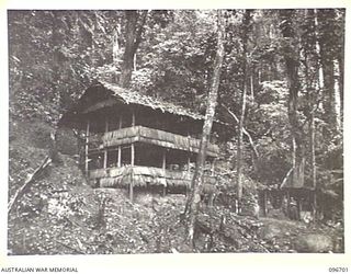 KAIRIRU ISLAND, NEW GUINEA. 1945-09-17. A TWO-TIERED HOUSE HIGH IN THE RANGES OF KAIRIRU, WHICH WAS THE HOME OF REAR-ADMIRAL S. SATO, FORMER JAPANESE NAVAL COMMANDER OF KAIRIRU AND MUSCHU ISLANDS. ..