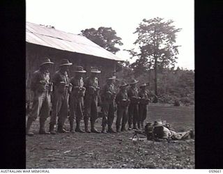SOGERI, NEW GUINEA. 1943-11-04. NO. 9 SECTION, 3RD PLATOON OF THE JUNIOR LEADERS COURSE BEING INSTRUCTED IN THE OPERATION OF THE BREN GUN AT THE NEW GUINEA FORCE TRAINING SCHOOL. LEFT TO RIGHT: ..