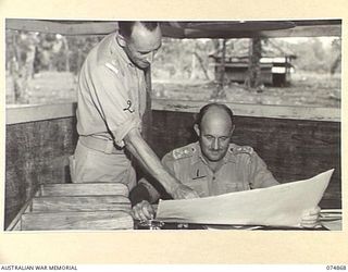 LAE NADZAB, NEW GUINEA. 1944-07-20. NX171 BRIGADIER A G TORR, DSO, CHIEF ENGINEER, HQ NEW GUINEA FORCE (1) AND VX89078 MAJOR J B MULVANY, STAFF OFFICER, ROYAL AUSTRALIAN ENGINEERS, (INTELLIGENCE) ..