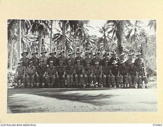 MADANG, NEW GUINEA. 1944-07-03. OFFICERS OF THE 24TH INFANTRY BATTALION. IDENTIFIED PERSONNEL ARE:- VX51657 LIEUTENANT W.E. SMITH (1); VX104159 LIEUTENANT J.A. IRVING (2); VX111284 CHAPLAIN J.C. ..