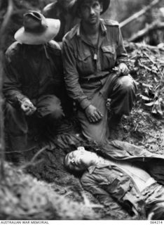 SHAGGY RIDGE, NEW GUINEA. 1944-01-22. AFTER TROOPS OF THE 2/12TH INFANTRY BATTALION HAD PULLED THEMSELVES, HAND OVER HAND, UP ROPES ON THE FACE OF MOUNT PROTHERO, THEY FOUND THAT THE WHOLE CREW OF ..