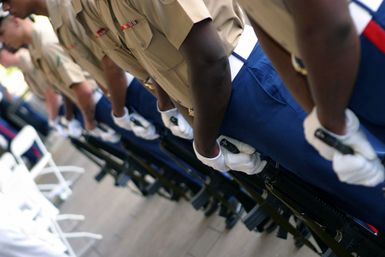 Members of the US Marine Corps (USMC) Base Honor Guard Team stand at parade rest, with their 5.56mm M16A2 rifles, during Memorial Service honoring the 26 Marines and Sailors from 1ST Battalion, 3rd Marine Regiment at Kaneohe Bay, Hawaii (HI), who died in a helicopter accident. The memorial was held in the State Capitol building