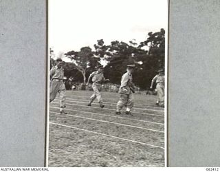 17 MILE, PORT MORESBY AREA, PAPUA, NEW GUINEA. 1943-12-25. THE OFFICERS MEDLEY RACE IN PROGRESS DURING THE 10TH AUSTRALIAN ADVANCED ORDNANCE DEPOT SPORTS MEETING