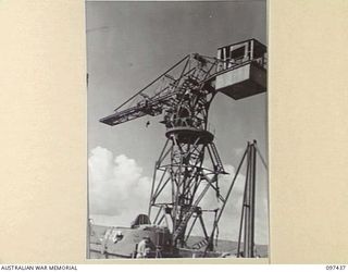 RABAUL, NEW BRITAIN. 1945-10-01. HUGE CRANE BUILT BY JAPANESE IN THE AREA NOW OCCUPIED BY 55 PORT CRAFT COMPANY. THE CRANE WAS DAMAGED BY OUR BOMBERS BEFORE IT COULD BE USED BY THE JAPANESE