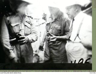 AITAPE, NORTH EAST NEW GUINEA. C. 1944-06. AIR COMMODORE F. R. W. SCHERGER, THE AIR OFFICER COMMANDING NO. 10 GROUP RAAF (LEFT), ARTHUR JOHN DEDMAN, THE MINISTER FOR WAR ORGANISATION OF INDUSTRY ..