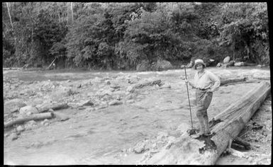 Sarah Chinnery crossing a river, New Guinea, 1933