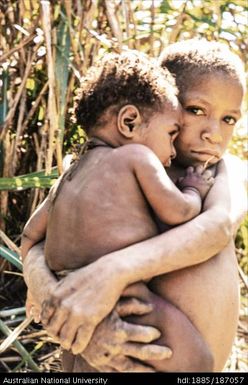 Boy holding younger boy