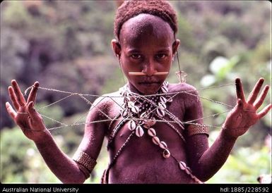 Girl showing string figure game