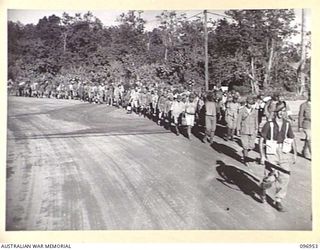 BOUGAINVILLE, 1945-09-23. JAPANESE NAVAL TROOPS FROM THE BUKA AREA, ESCORTED BY TROOPS OF 27 INFANTRY BATTALION, ON A 10-MILE MARCH TO A CONCENTRATION COMPOUND SOUTH OF THE TOROKINA RIVER WHERE ..
