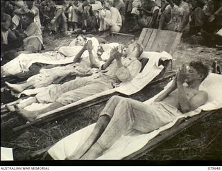 Oro Bay, New Guinea. 1943-04. Patients on stretchers at a unit concert held at the 10th Field Ambulance, Australian Army Medical Corps