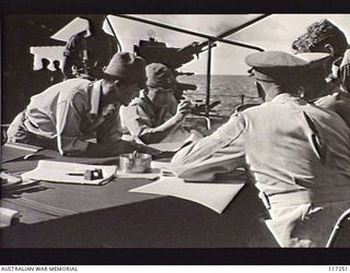 NAURU ISLAND. 1945-09-13. AUSTRALIAN AND JAPANESE OFFICERS CONFERRING PRIOR TO THE SIGNING OF THE INSTRUMENT OF SURRENDER OF THE JAPANESE FORCES IN THE AREA ABOARD THE ROYAL AUSTRALIAN NAVY VESSEL ..