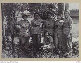 LAE, NEW GUINEA. 1945-05-15. ASSISTANT MILITARY SECRETARY REGISTRY CLERKS AND TYPISTS OUTSIDE THEIR OFFICE AT HEADQUARTERS FIRST ARMY. A FEW DAYS AFTER THEIR ARRIVAL FROM AUSTRALIA, AUSTRALIAN ..