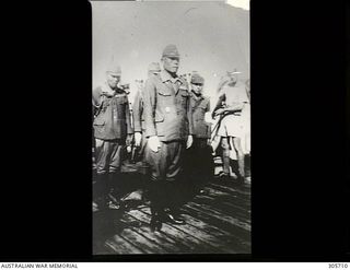 NAMATANAI, NEW IRELAND. 1945-09-19. THE SURRENDER OF GENERAL ITO (SECOND FROM LEFT), COMMANDER IN CHIEF OF JAPANESE FORCES ON NEW IRELAND, TO MAJOR GENERAL K. W. EATHER CB CBE DSO ED, GENERAL ..