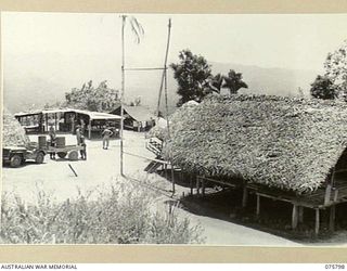 SIAR-NAGADA, NEW GUINEA. 1944. THE NATIVE VILLAGE OF NOBINOB WHICH HAS BEEN TAKEN OVER AND USED AS HEADQUARTERS FOR A COMPANY, 61ST INFANTRY BATTALION "THE QUEENSLAND CAMERON HIGHLANDERS"