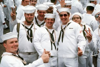 Crewmen of the combat stores ship USS NIAGARA FALLS (AFS 3) pose for a group picture upon arriving at Naval Station Guam