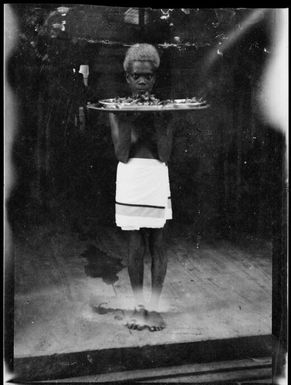 Young boy with tray, Awar [?], Sepik River,  New Guinea, 1935 / Sarah Chinnery