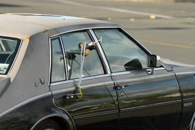 A hook and line kit is attached to the window of a car containing a simulated bomb during training at the Marine Corps Base Hawaii, Hawaii, Post Exchange parking lot on Dec. 9, 2004.(U.S. Marine Corps official photo by CPL. Nicholas Riddle) (Released)