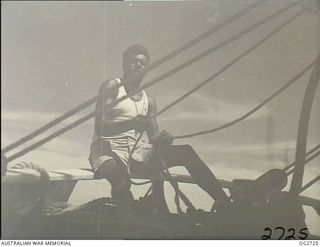 PORT MORESBY, PAPUA. C. 1944. A PAPUAN NATIVE MEMBER OF THE CREW OF A SAILING VESSEL USED BY THE RAAF RESCUE SERVICE