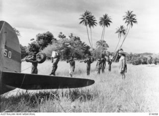 1943-01-11. SALVAGING AEROPLANES IN NEW GUINEA. LITTLE IS HEARD OF THE GROUND STAFF OF THE RAAF - THE MEN WHO WORK ALL HOURS AND UNDER ALL CONDITIONS, KEEPING OUR PLANES IN THE AIR, AND STILL LESS ..